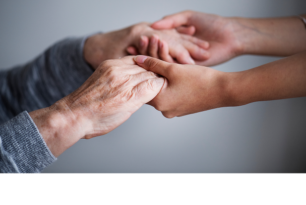 Two people holding hands
